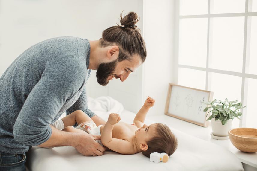 Man treating baby's diaper rash