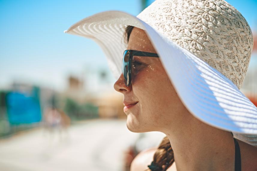 Woman using tinted sunscreen