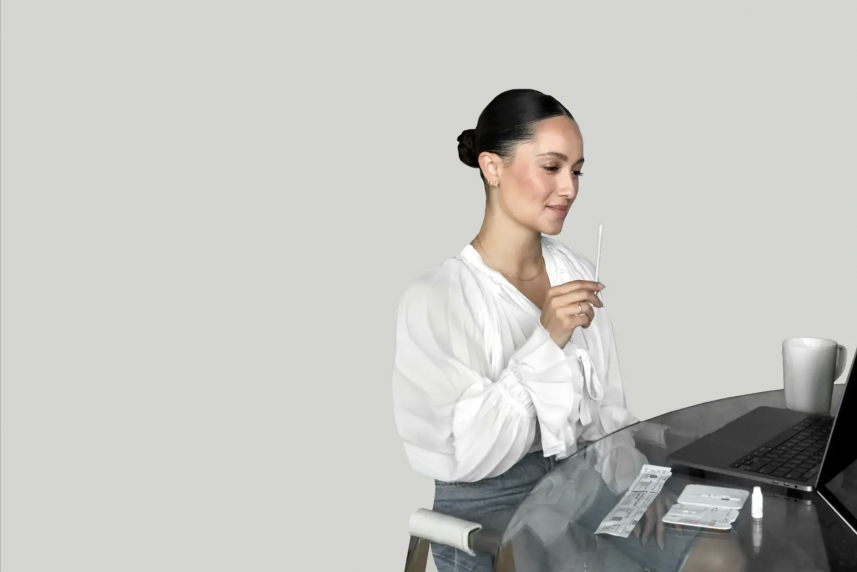 Women at desk with laptop for a story about at-home COVID testing