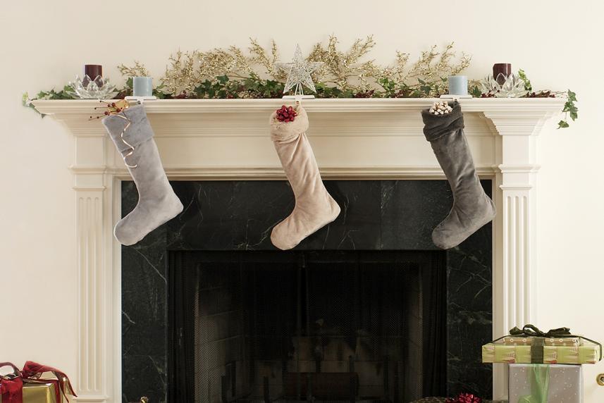 Christmas stockings hung on a fireplace